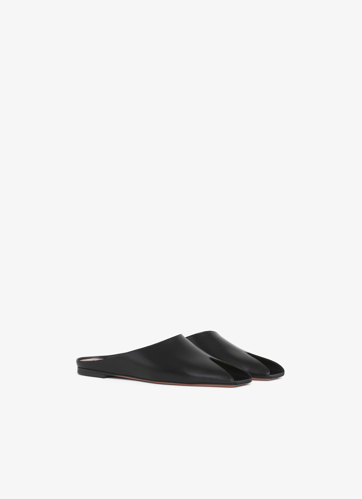 MULE SPIKE FLAT IN PELLE DI VITELLO ALAÏA MULE SPIKE FLAT IN PELLE DI VITELLO NERO